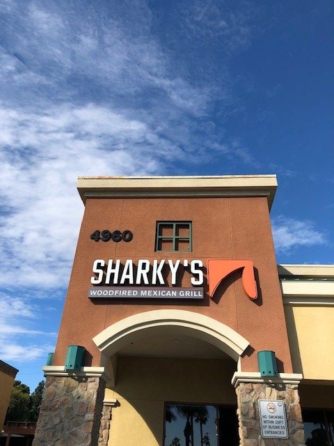 The front of a Sharky's restaurant.